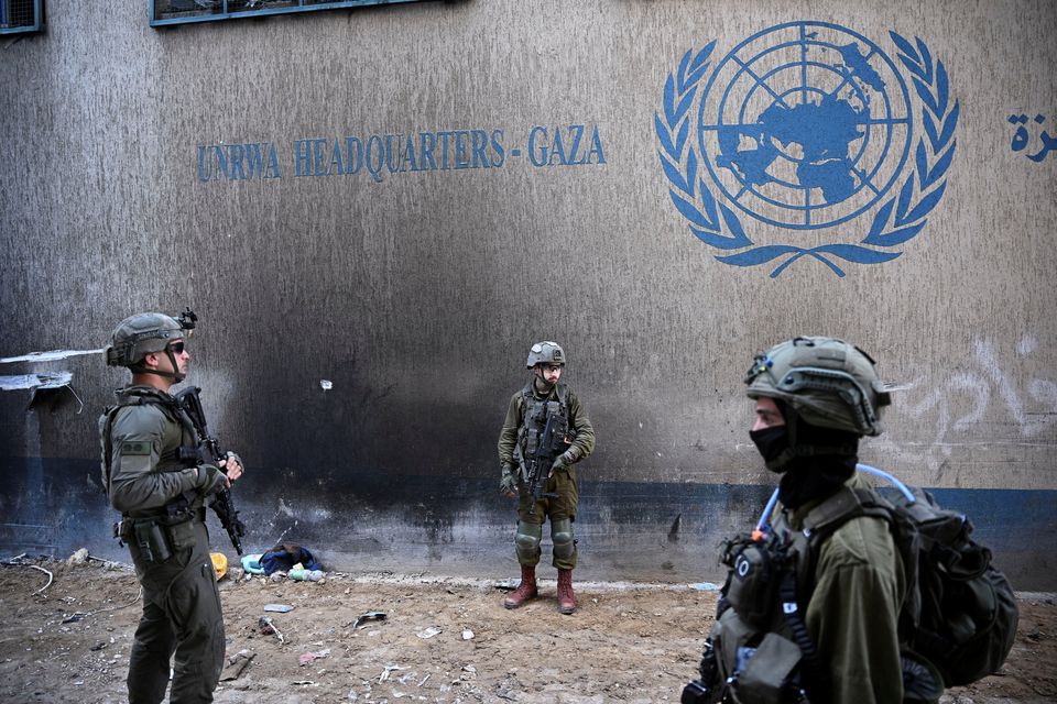 IDF soldiers next to the UNRWA headquarters in the Gaza Strip. Photo: Reuters
