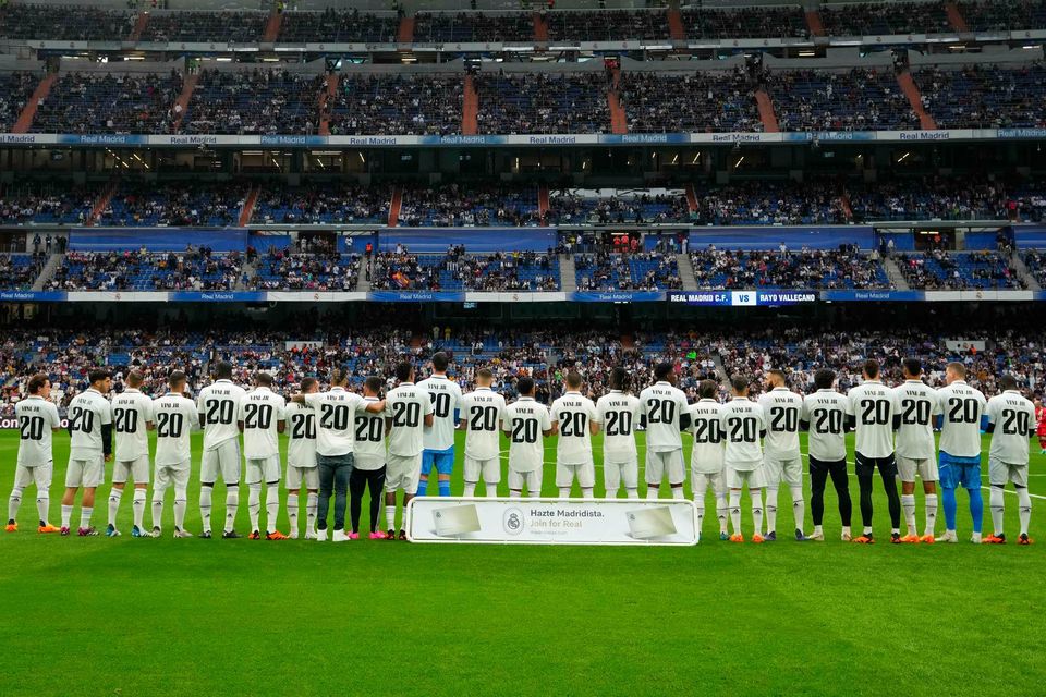 Players of Real Madrid wear jerseys with the name of team-mate Vinicius Junior before their LaLiga match on Wednesday (Manu Fernandez/AP)
