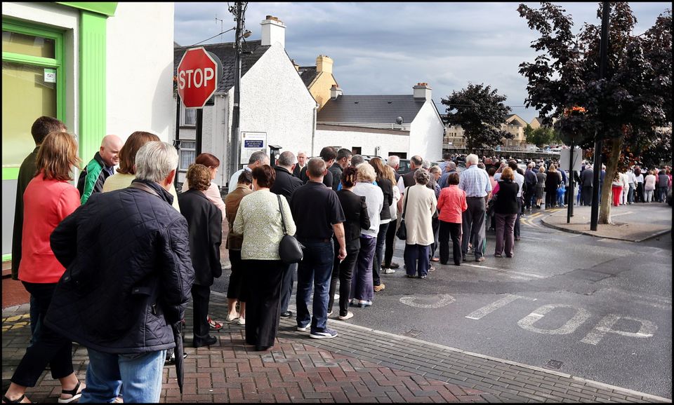 Crowds gather at Flynn's Funeral Home on The Strand along the banks of the Shannon for Larry and Martina Hayes tragically killed in Tunisia who were reposing there.
Pic Steve Humphreys
2nd July 2015.