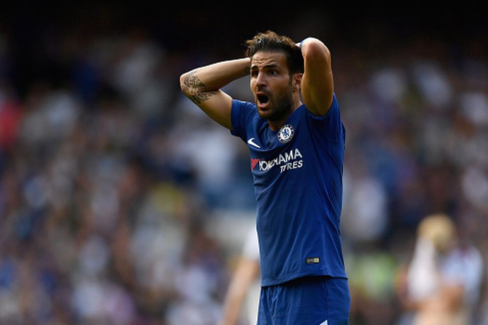 Cesc Fabregas reacts to his second half red card.