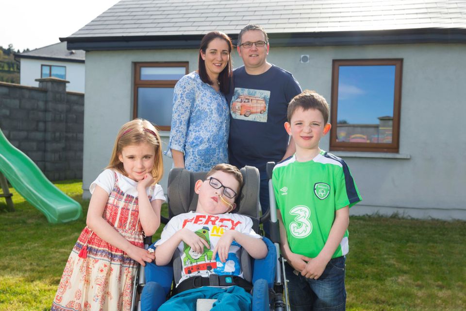Michelle and Michael Russell from Carrick on Suir, Co. Tipperary with their children, triplets, Ruth, Cillian and Conor who are 5 years old. Photo: Patrick Browne