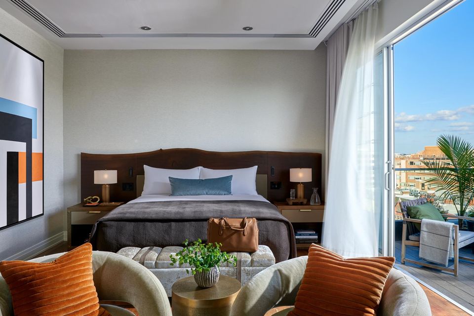 A stylish bedroom with balcony at the Dupont Circle Hotel in Washington DC