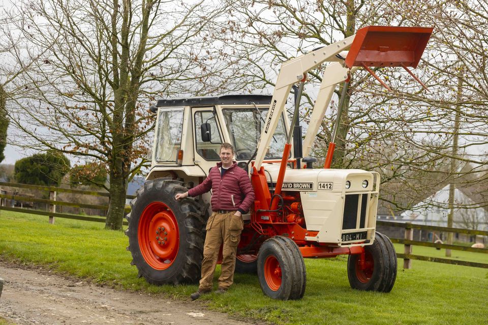 Good as new: Patrick Kehoe with his late father’s refurbished 1980 David Browne 1412 on the family farm at  Ballyroebuck, Bunclody, Co Wexford. Photos: Patrick Browne
