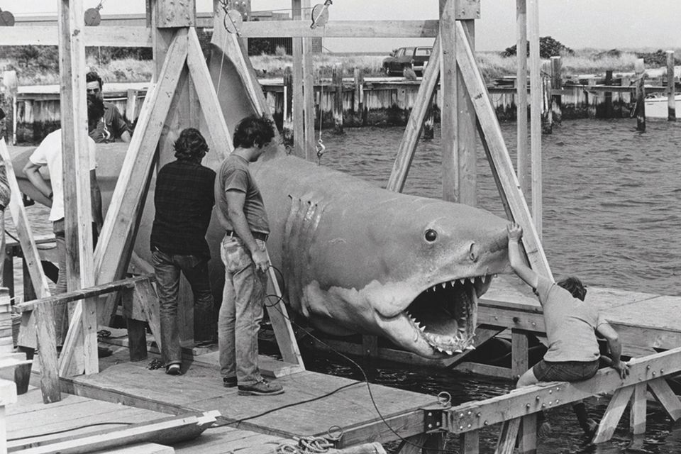 The mechanical shark is lowered into the water ahead of a scene in June, 1974. Photo: Reuters