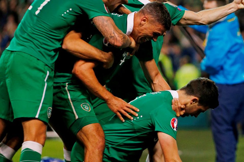 Shane Long celebrates with team mates after scoring the first goal for Republic of Ireland