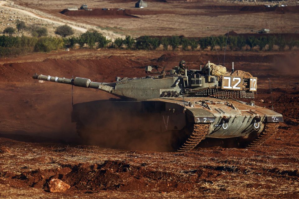 An Israeli soldier in a tank participates in a military drill near Israel's border with Lebanon in northern Israel, October 26, 2023. REUTERS/Lisi Niesner