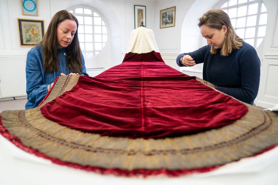 Work is carried out on King Charles's robe which he will wear at the coronation service