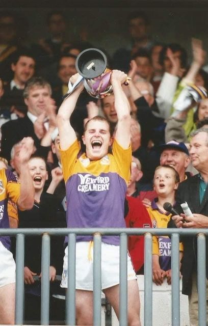 James Bolger lifting the trophy after captaining Wexford to the Leinster Junior football championship title in 2000.