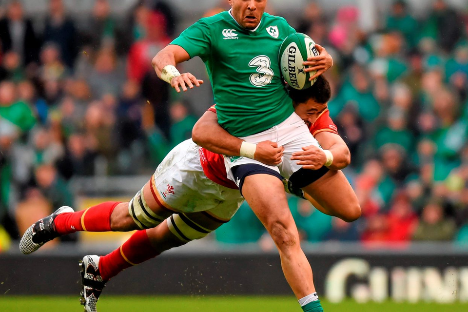 Ireland’s Simon Zebo is tackled by Taulupe Faletau during their draw. Picture credit: Stephen McCarthy / Sportsfile