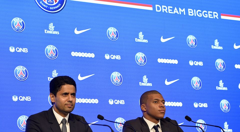 Paris Saint-Germain President Nasser Al Khelaifi and new signing Kylian Mbappe speak to the media during a press conference at the Parc des Princes on September 6, 2017 in Paris, France. Kylian Mbappe signed a five year contract for 180 Million Euro.  (Photo by Aurelien Meunier/Getty Images)