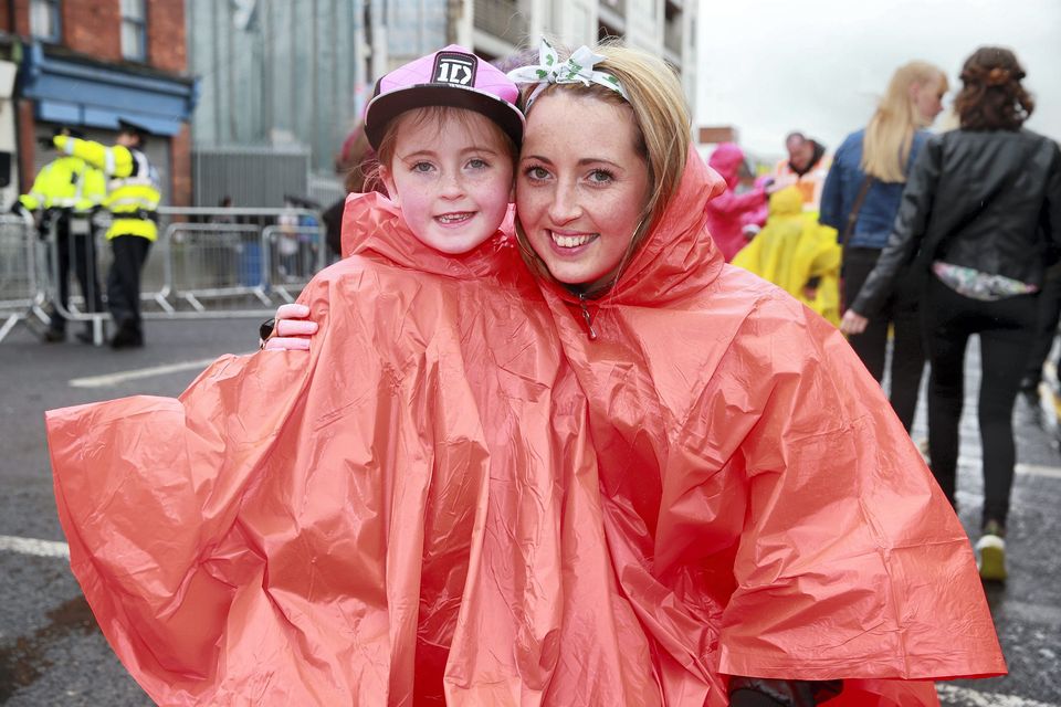 One Direction fans Tiffany Webb, age 6 and Tanya Maloney, from Athy, on their way to see the band at Croke Park, Dublin.. Picture:Arthur Carron