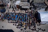thumbnail: Palestinians perform the first Friday prayers of the Muslim holy month of Ramadan near the ruins of a destroyed mosque by the Israeli airstrikes in Rafah, Gaza Strip, Friday, March 15, 2024. (AP Photo/Fatima Shbair)