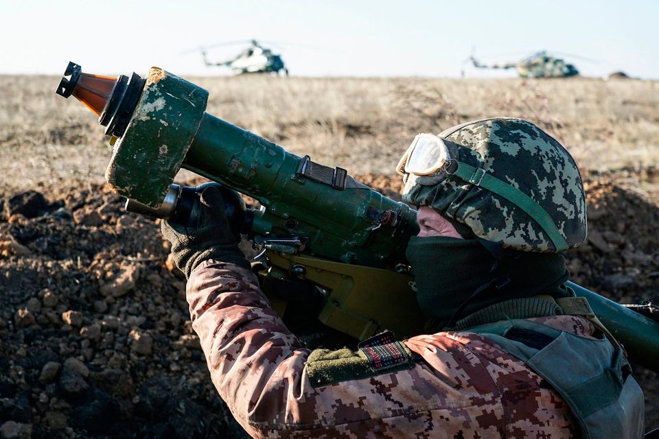 On alert: A Ukrainian soldier aims an anti-aircraft rocket launcher during military exercises in eastern Ukraine. Photo: PA