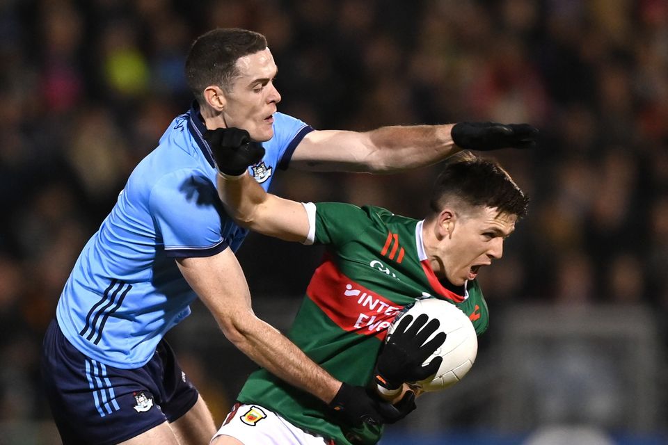 Brian Fenton tackles Fergal Boland during Mayo's win over Dublin.