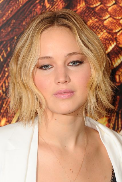 Jennifer Lawrence attends the photocall for "The Hunger Games: Mockingjay Part 1" at Corinthia Hotel London