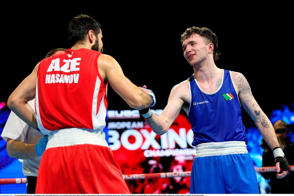 24 April 2024; Dean Clancy of Ireland right, and Malik Hasanov of Azerbaijan after their Men's 63.5kg Light Welterweight quarter-final bout during the 2024 European Boxing Championships at Aleksandar Nikolić Hall in Belgrade, Serbia. Photo by Nikola Krstic/Sportsfile