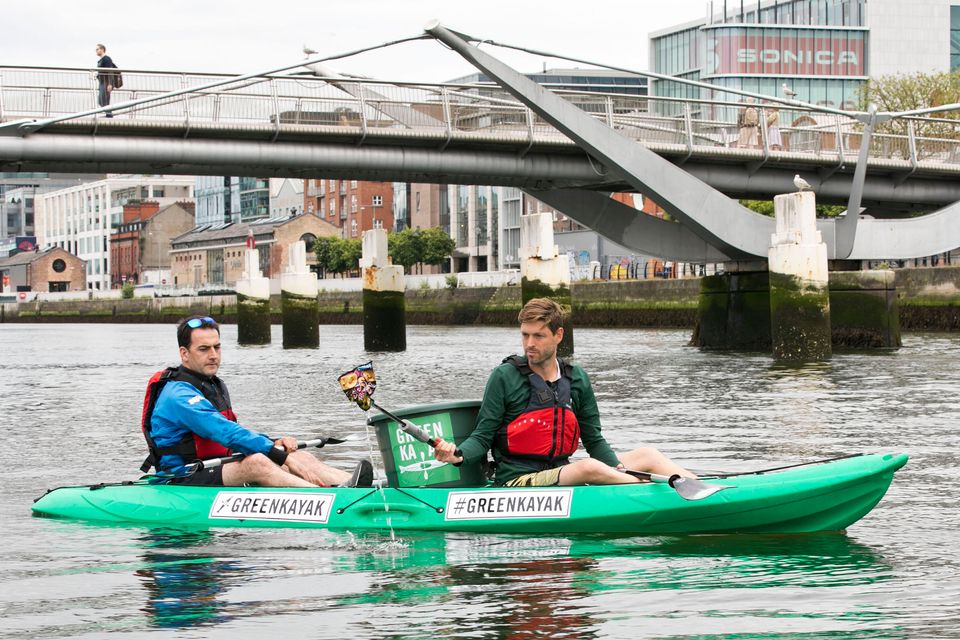 Green wave: Founder of GreenKayak Tobias Weber (right) and Dublin City Council climate action regional office member David Dodd picking up rubbish from the river Liffey as the Danish based NGO, in partnership with Dublin City Kayaking, launched the Dublin GreenKayak Initiative. Photo: PA