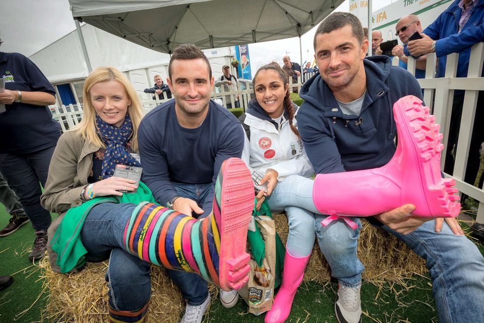 Rugby stars Rob and Dave Kearney were at the National Ploughing Championships where they took part in the ‘Welly Line-Out’. They are pictured with winners Edel McGuane from Co Clare (left) and Roza Harrison from Co Wexford. Photo: Dylan Vaughan
