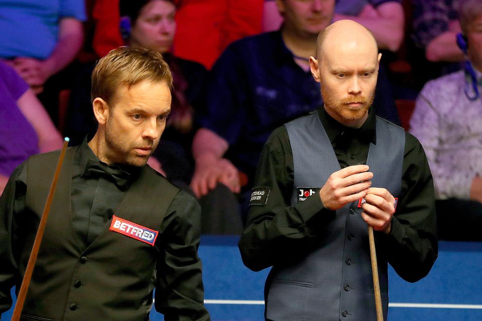 Ali Carter (left) and Gary Wilson during day twelve of the 2019 Betfred World Championship at The Crucible, Sheffield. Richard Sellers/PA Wire