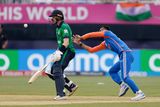 thumbnail: India's bowler Axar Patel reaches to catch and bowl out for a duck Ireland's Barry McCarthy during an ICC Men's T20 World Cup cricket match at the Nassau County International Cricket Stadium in Westbury, New York. Photo: AP Photo/Adam Hunger