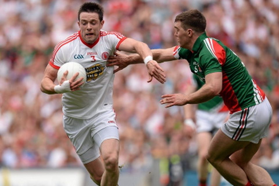 Tyrone's Conor Clarke in action against Seamus O'Shea