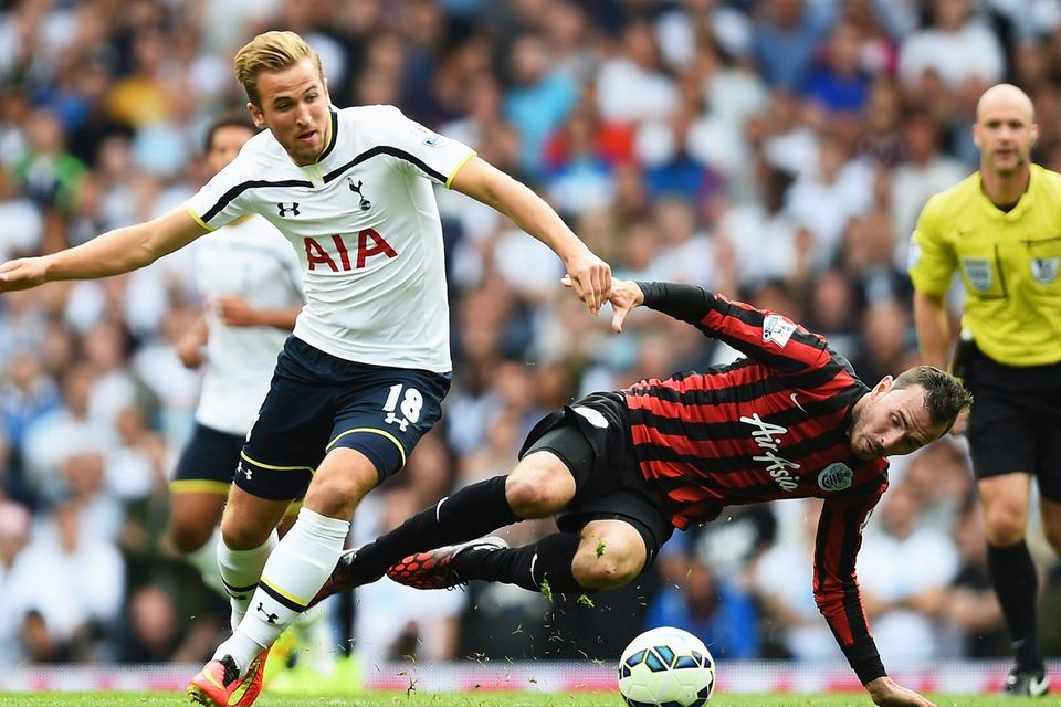 Spurs forward Harry Kane gets away from Jordon Mutch of QPR during the Premier League match at White Hart Lane. Photo: Jamie McDonald/Getty Images