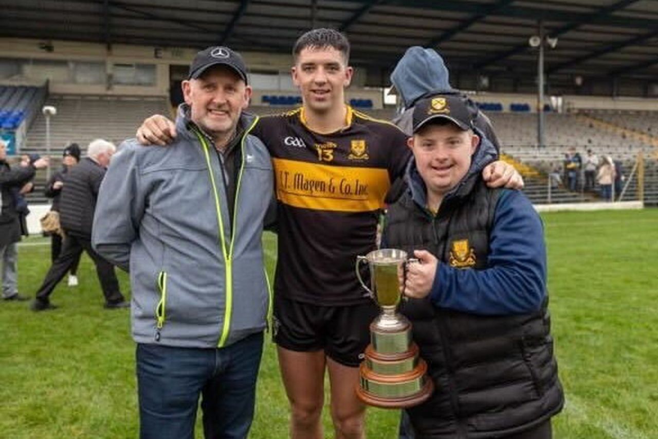 Kerry and Dr. Crokes forward Tony Brosnan (centre) with his brother Stephen (right), who is stats man for the Killarney champions, and their father Tommy.