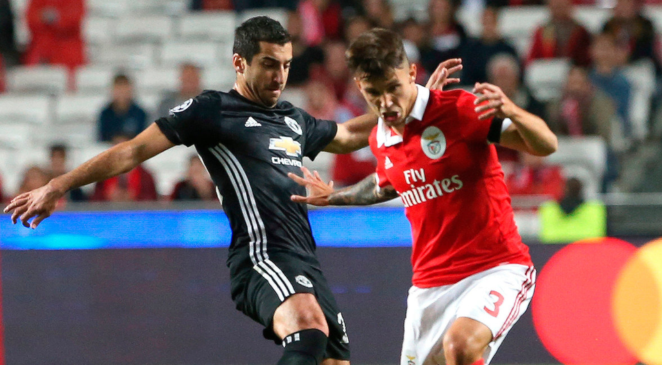 Benfica's Alejandro Grimaldo, right, challengers Manchester United's Henrikh Mkhitarya  for the ball during their Champions League clash. Photo: Armando Franca/AP