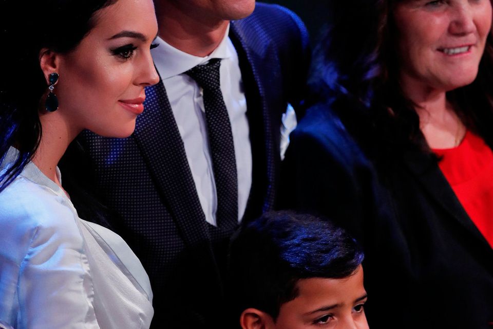 Real Madrid’s Cristiano Ronaldo celebrates after winning The Best FIFA Men’s Player Award with partner Georgina Rodriguez, son Cristiano Jr. and mother Maria Dolores dos Santos Aveiro   REUTERS/Eddie Keogh
