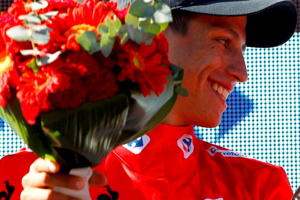 Esteban Chaves Rubio celebrates his red jersey on the podium of the third stage of the 2015 Vuelta Espana cycling tour