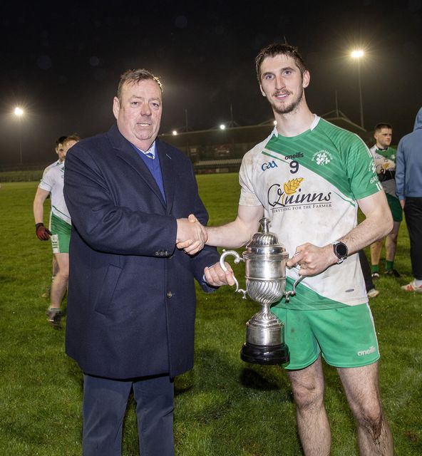 Wicklow GAA Chairman Damien Byrne presents the Lawless' Cup to Baltinglass captain Pat Burke after they finished top of the SFL Division 1A proper. 