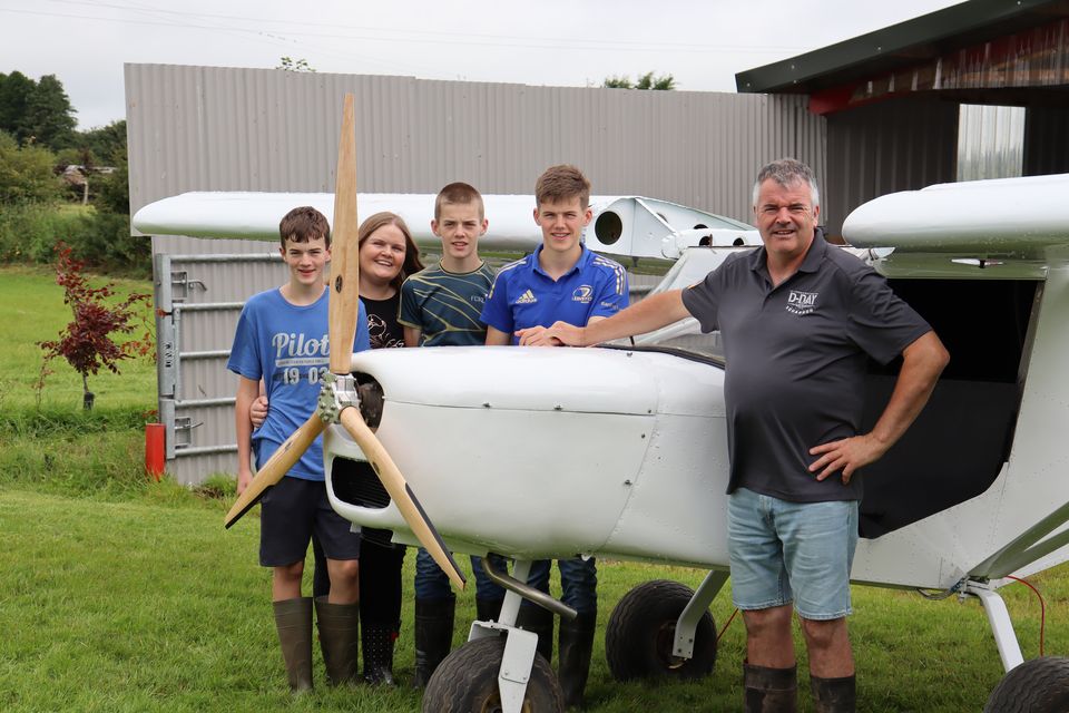 Gerry Lynch with wife Jennifer, their sons (Tom, Matt and Sam) and his two-seater plane at Clonkeiffy Farm in Co Cavan