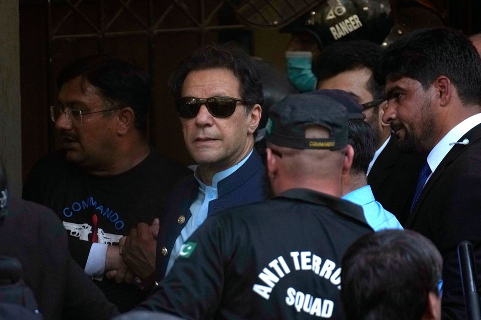 Pakistan’s former prime minister Imran Khan, centre, arrives at court in Islamabad, Pakistan, where he was granted bail of two weeks. Photo: AP Photo/Anjum Naveed