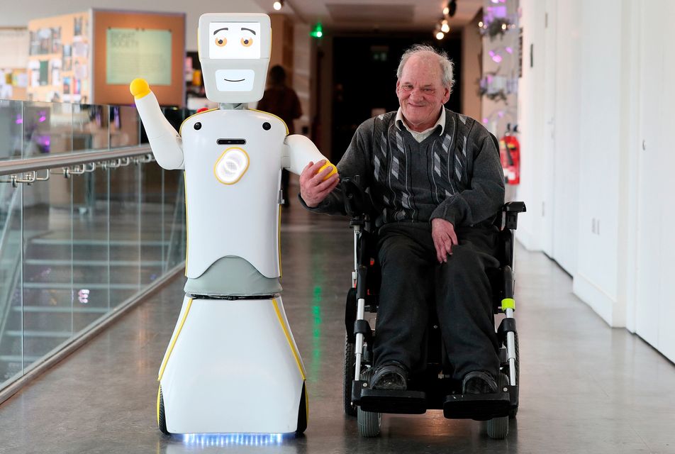 IrelandÕs first socially assistive AI robot 'Stevie II' from robotics engineers at Trinity College Dublin, with Brendan Crean, who helped trial the robot through the charity ALONE, during a special demonstration at the Science Gallery in Dublin. 
Brian Lawless/PA Wire