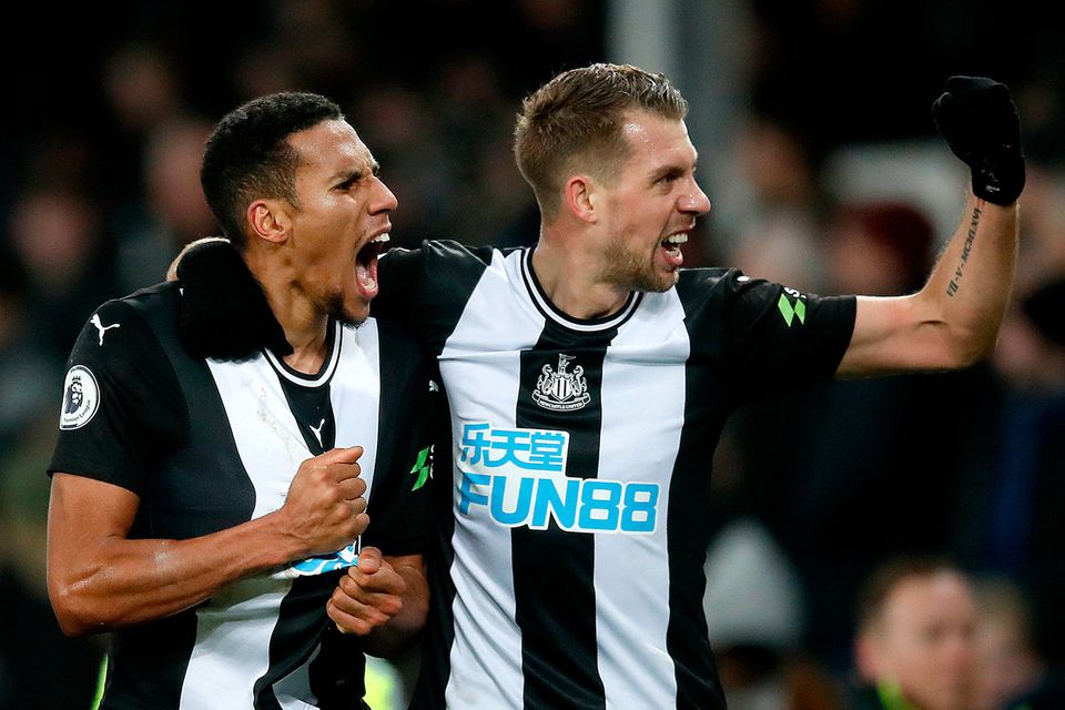 Florian Lejeune (right) celebrates scoring his and Newcastle's side's second goal with team-mate Isaac Hayden during the Premier League draw at Goodison Park