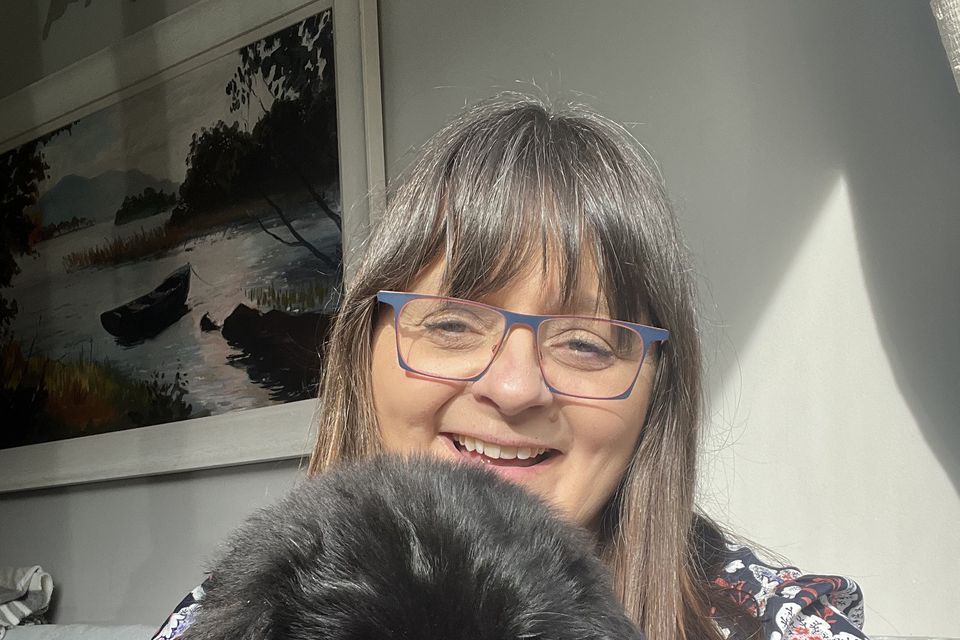 Interior designer Gwen Kenny with one of her dogs