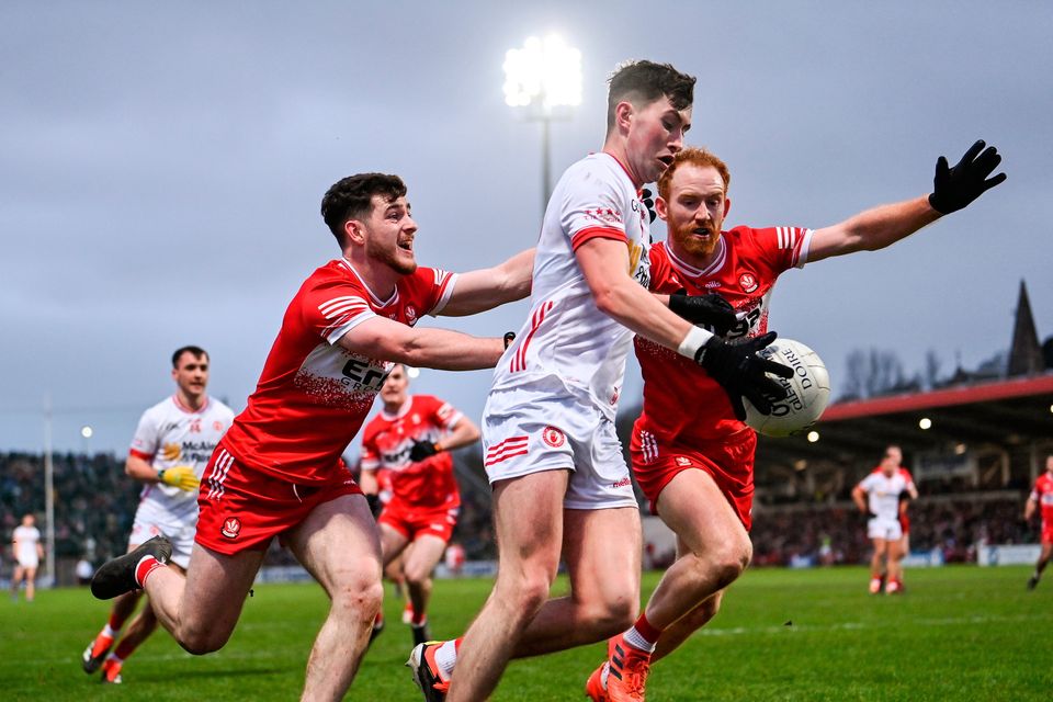 Ciarán Daly of Tyrone in action against Padraig McGrogan, left, and Conor Glass of Derry