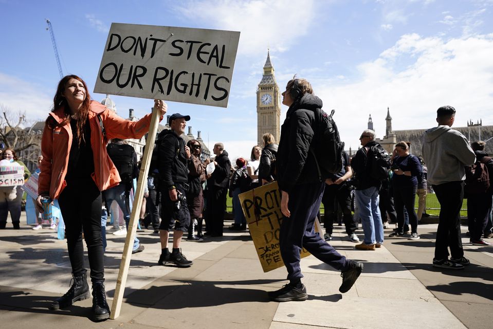 Campaigners take part in a rally organised by trans rights groups, trade unions, and community organisations at Parliament Square, central London, following the Supreme Court ruling on the definition of a woman in equalities law (Andrew Matthews/PA)