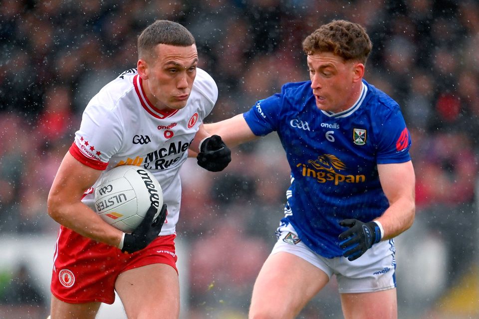 Tyrone's Conn Kilpatrick in action against Cavan's Ciarán Brady during their Ulster SFC quarter-final at O'Neills Healy Park, Omagh. Photo: Ramsey Cardy/Sportsfile
