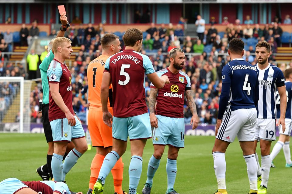 Match-winner Hal Robson-Kanu, right, is shown the red card at Turf Moor