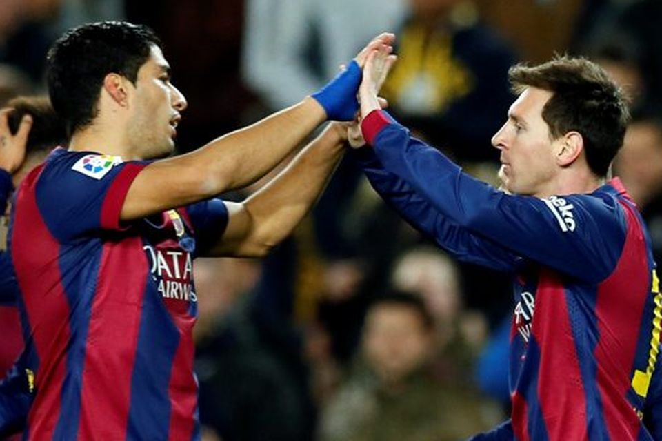 Barcelona's Luis Suarez and Lionel Messi (R) celebrate a goal against Villarreal