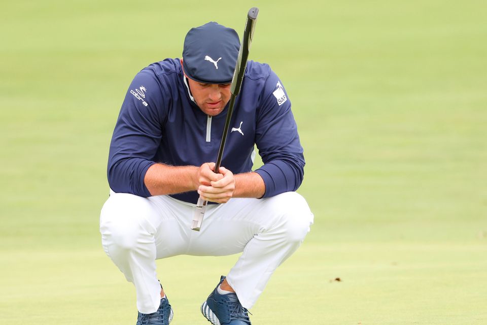 LEAD: Bryson DeChambeau of the United States lines
up a putt on the 17th hole during the second round of the 120th US Open at Winged Foot Golf Club in Mamaroneck, New York