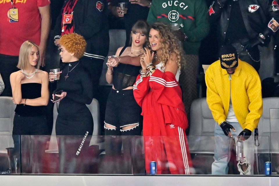 Ashley Avignone, from left, Ice Spice, Taylor Swift and Blake Lively talk before the NFL Super Bowl 58 football game between the San Francisco 49ers and the Kansas City Chiefs on Sunday, Feb. 11, 2024, in Las Vegas.  (AP Photo/David Becker)