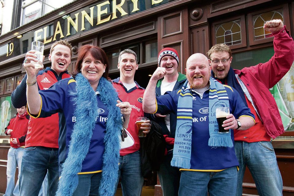 Cheers: rugby fans enjoy a pint