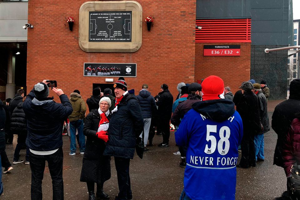 Fans arrive at Old Trafford in Manchester for the 60 Years Since The Munich Air Disaster commemorative ceremony. PRESS ASSOCIATION Photo. Picture date: Tuesday February 6, 2018. See PA story SOCCER Man Utd. Photo credit should read: Simon Peach/PA Wire.