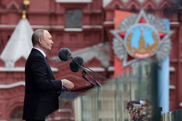 Diminished Putin salutes troops on Victory Day, but big guns are barred from Red Square