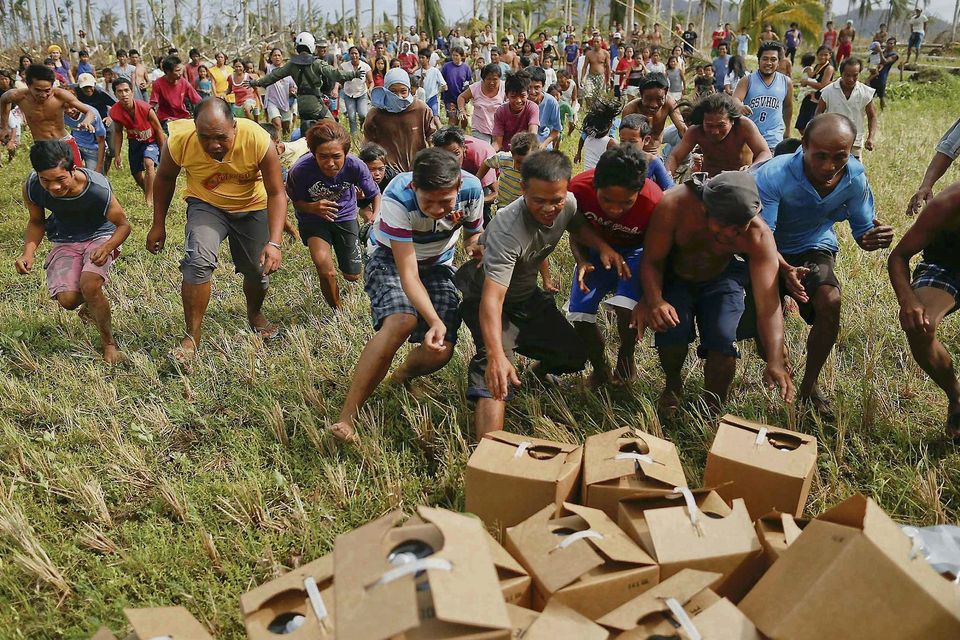 Survivors of Typhoon Haiyan in the Philippines scramble for supplies. Photo: Reuters