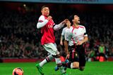 thumbnail: Liverpool's Uruguayan striker Luiz Suarez is brought down by Arsenal's English striker Alex Oxlade-Chamberlain during the English FA Cup fifth round football match between Arsenal and Liverpool at The Emirates Stadium, February 16, 2014