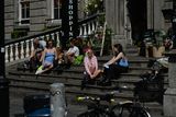thumbnail: People enjoy a sunny afternoon on the steps near the entrance to Dublin's Powerscourt Center. On Monday, 21 June 2021, in Dublin, Ireland.
