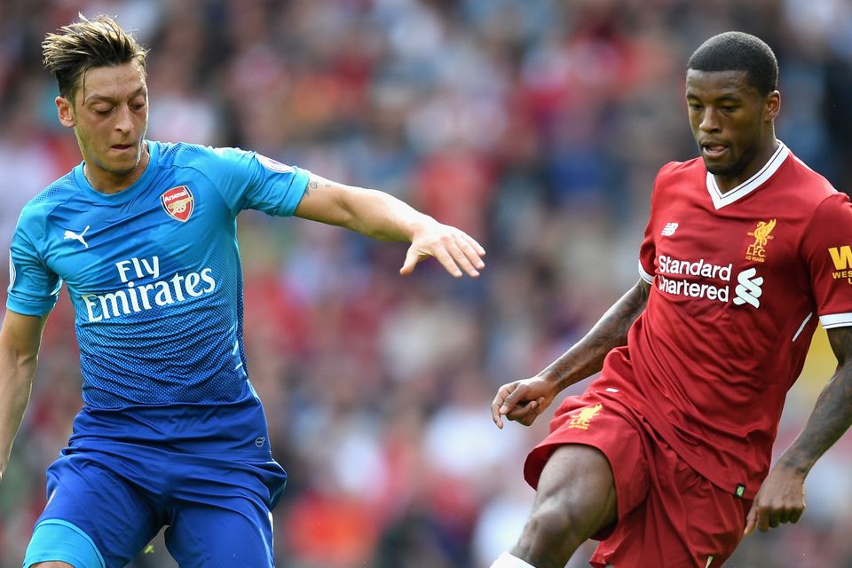 Arsenal's Mesut Ozil and Georginio Wijnaldum of Liverpool battle for possession when the two teams met in August. Photo: Michael Regan/Getty Images